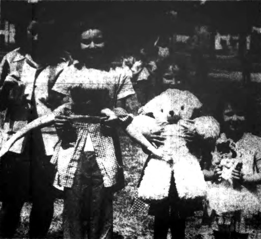 "MEET THE WINNERS—Doll show winners yesterday at the 112th Street Playground proudly display their prize-winning entries.  Left to right are Carolyn Dallas and her smallest doll, Carol O'Brien with the largest doll; Lorraine Mangione with the best stuffed animal and Gretchen Herd with the prettiest doll." Times Record. July 8, 1943: 18 cols 2-4.